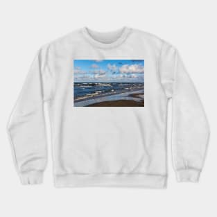 White cumulus clouds in sky over wavy Baltic sea Crewneck Sweatshirt